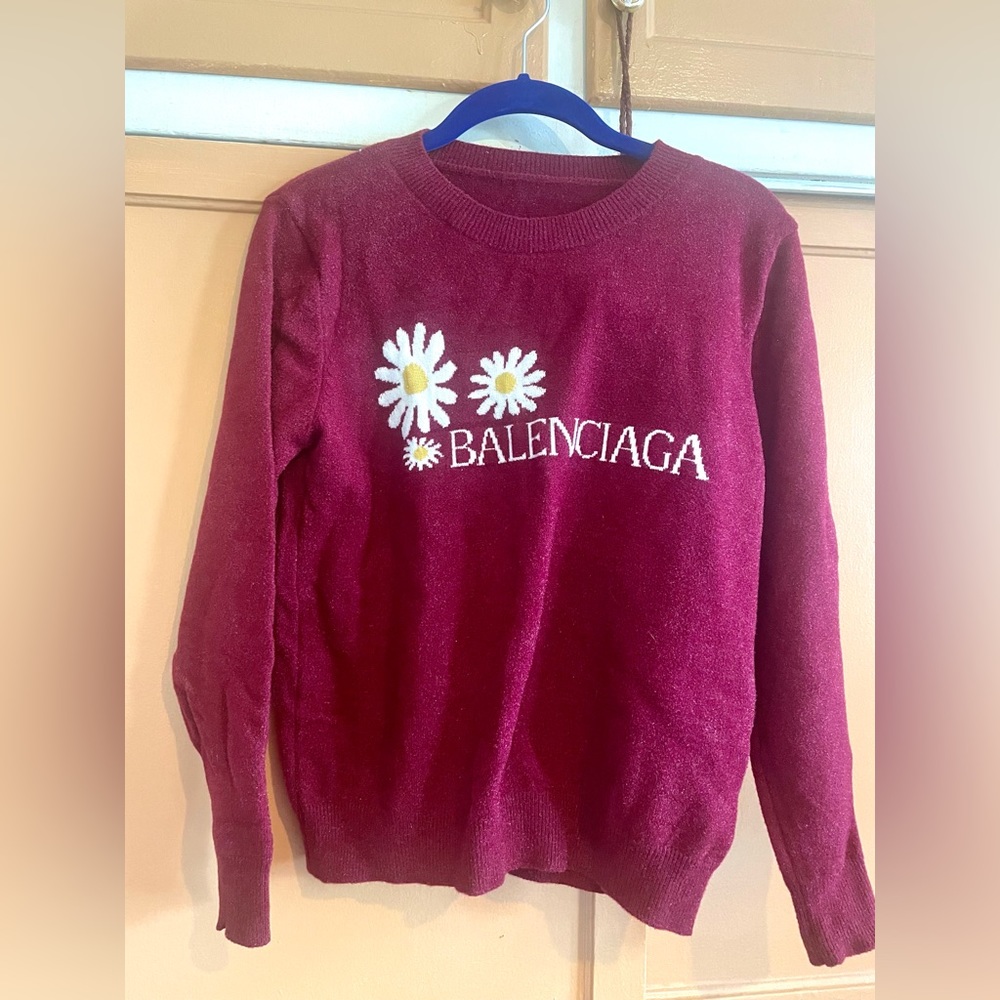 Long sleeve top/sweater. Berry color with daisies a good stretch.